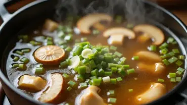 Aromatic mushroom broth simmering in a pot