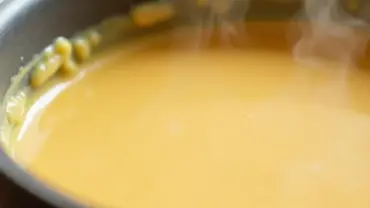 Close-up of creamy vegan cheese sauce in a saucepan