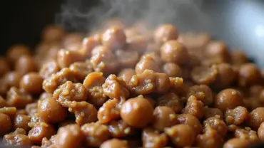 Sizzling plant-based beef cooking in a wok.