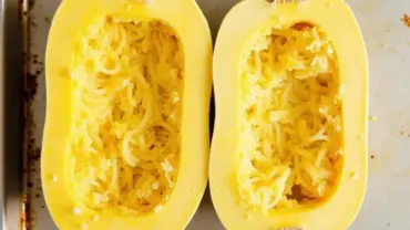 Halved spaghetti squash ready for roasting