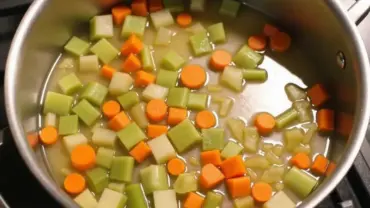 Olive oil and chopped vegetables in a pot