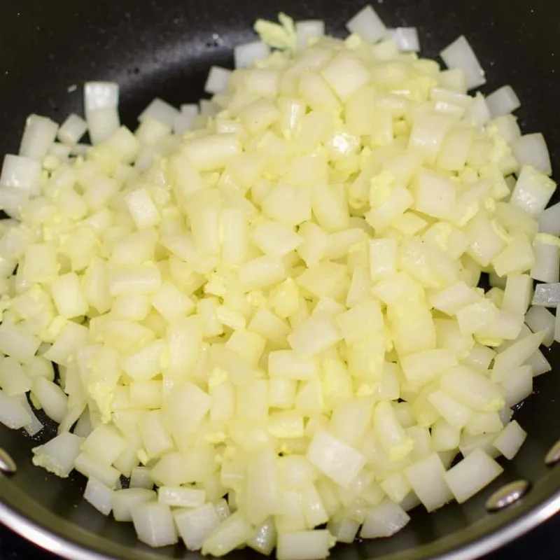 Onions and garlic sauteing in a pan