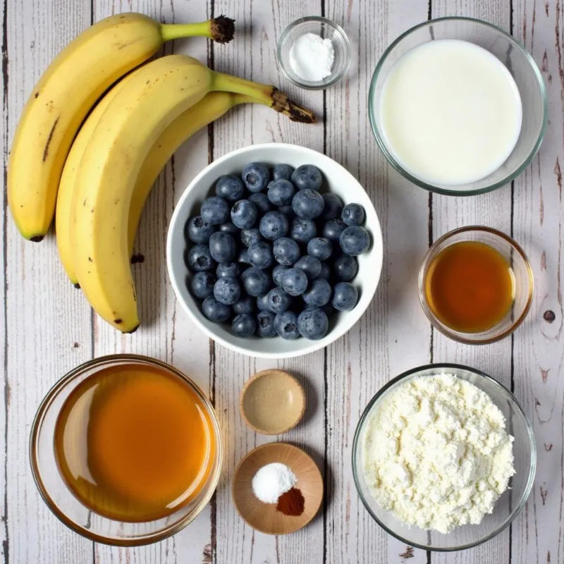 Vegan banana blueberry muffin ingredients laid out on a table