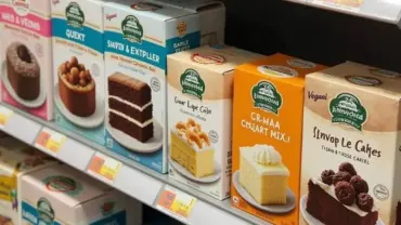 Assortment of Vegan Box Cake Mixes on a Shelf