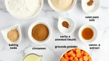 A flat lay image of the ingredients needed to make vegan carrot cake cupcakes