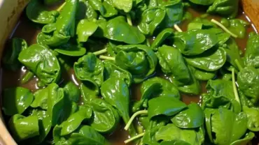 Vegan collard greens simmering in a pot