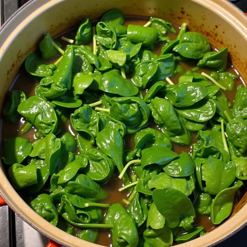 Vegan collard greens simmering in a pot