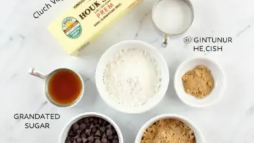 Vegan cookie dough ingredients laid out on a marble countertop