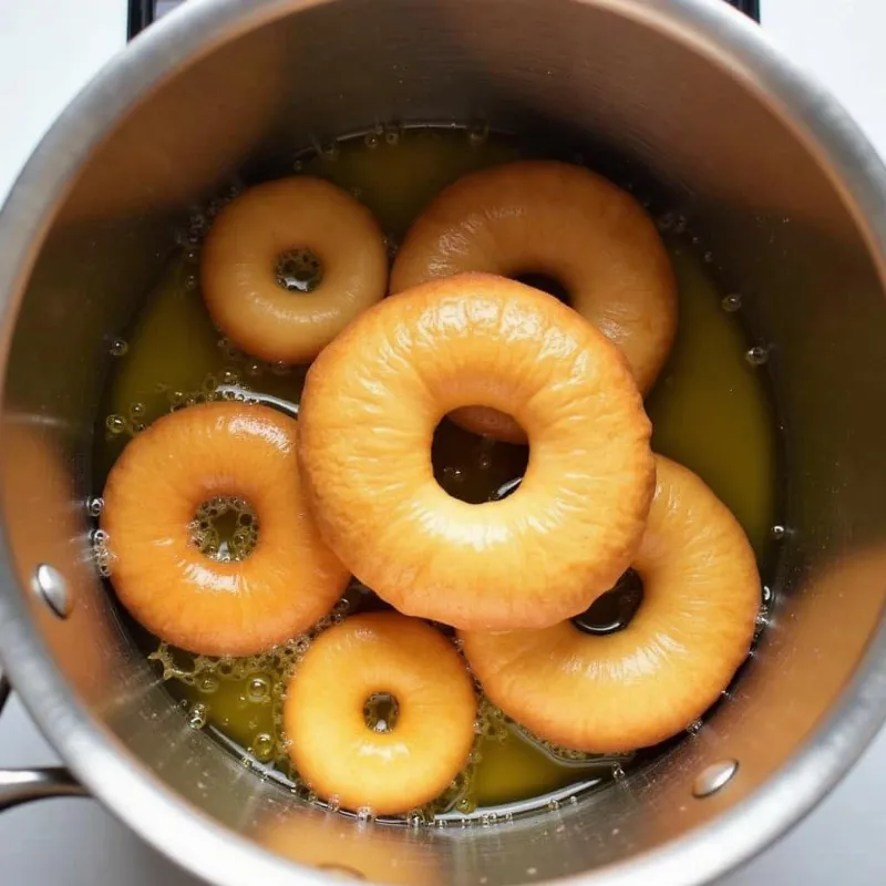 Vegan Donuts Being Fried in Oil 