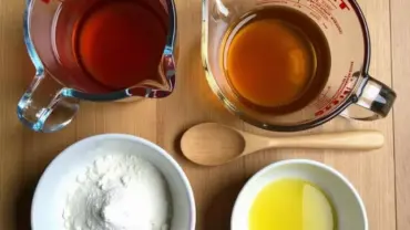 Vegan gummy bear ingredients neatly arranged on a table