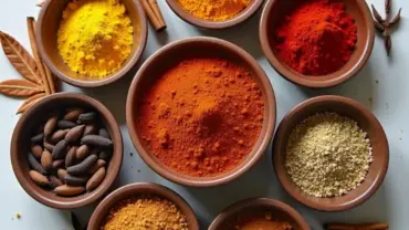 A colorful array of spices commonly used in vegan Indian curries.