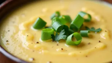 Vegan Irish Potato Soup in a bowl with green onions