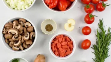 A colorful spread of vegan lasagna soup ingredients