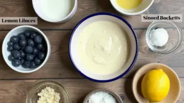 Vegan lemon blueberry cake ingredients arranged on a table