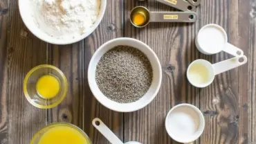 Ingredients for vegan lemon poppy seed muffins arranged on a table