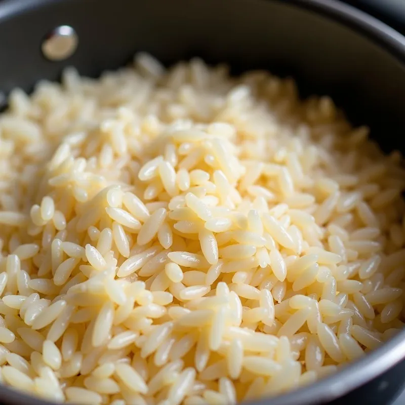 Toasting the rice for vegan mexican rice