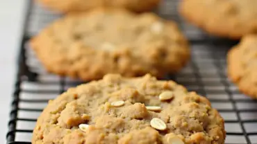 Vegan oatmeal cookies cooling on a wire rack