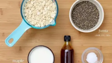 Vegan overnight oats ingredients: rolled oats, plant-based milk, chia seeds, maple syrup, vanilla extract, and salt.