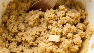 Vegan pecan pie bar dough being mixed in a bowl