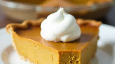 Slice of vegan pumpkin pie on a plate