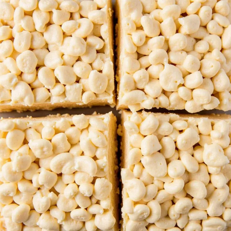 Perfectly cut vegan rice krispie treats in a pan, ready to serve.