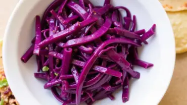 Vegan slaw in a bowl, ready to be added to tacos