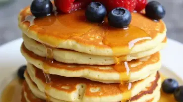 Stack of fluffy vegan sourdough pancakes