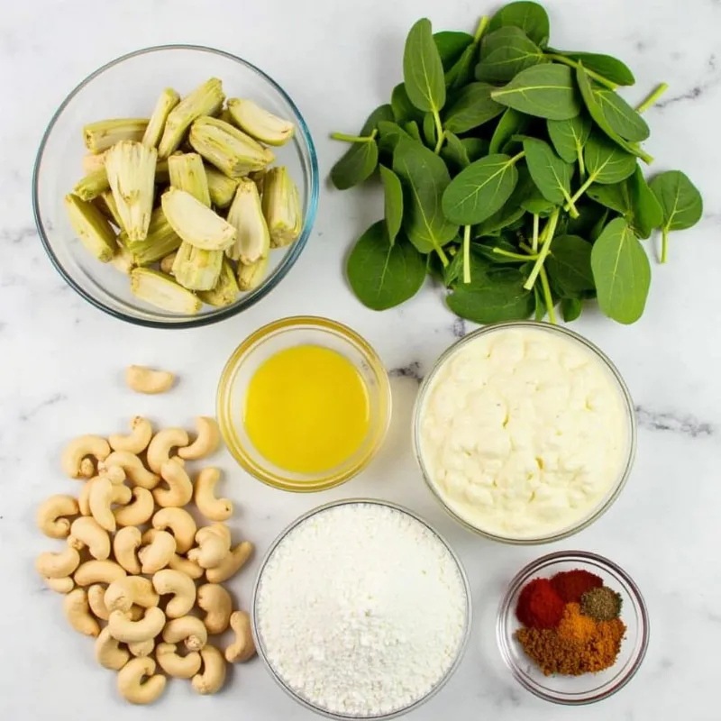 Vegan spinach artichoke dip ingredients arranged on a table