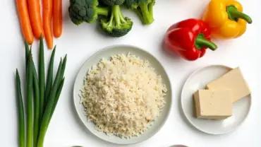 A colorful spread of fresh vegetables, tofu, and spices laid out on a table, ready for making vegan stir fry rice.