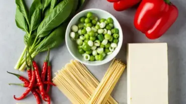 Colorful array of fresh ingredients for vegan thai drunken noodles