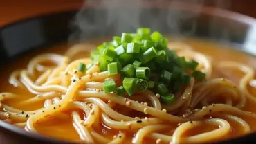 Steaming bowl of vegan udon noodle soup