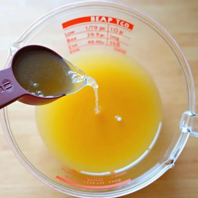 Vegetable broth in a measuring cup